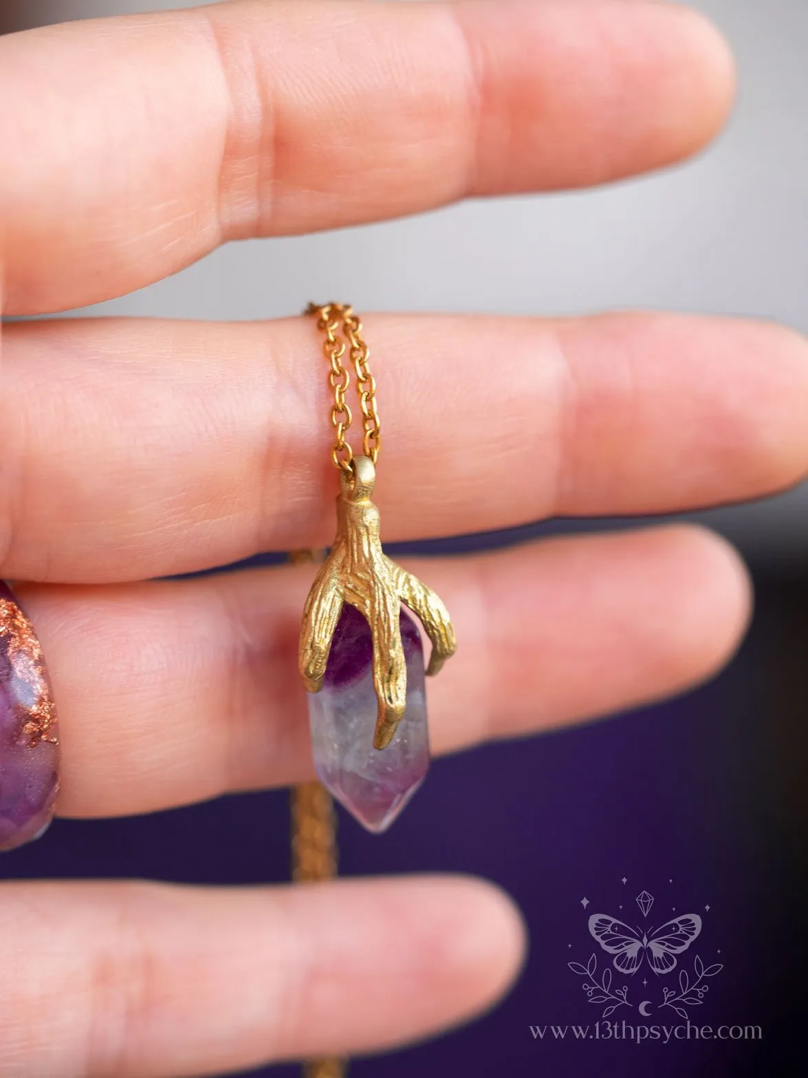 Bird claw and fluorite pendant necklace