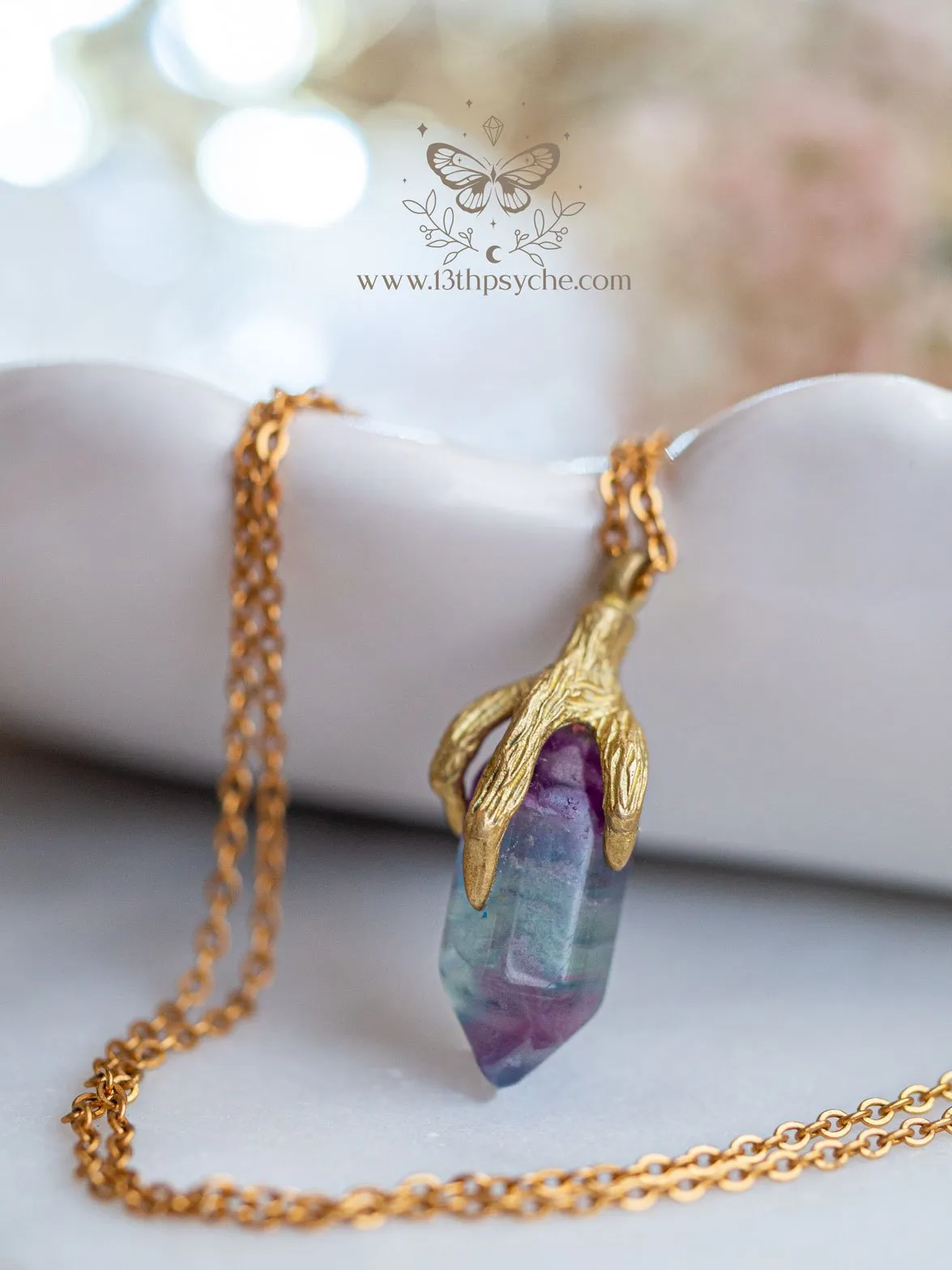 Bird claw and fluorite pendant necklace